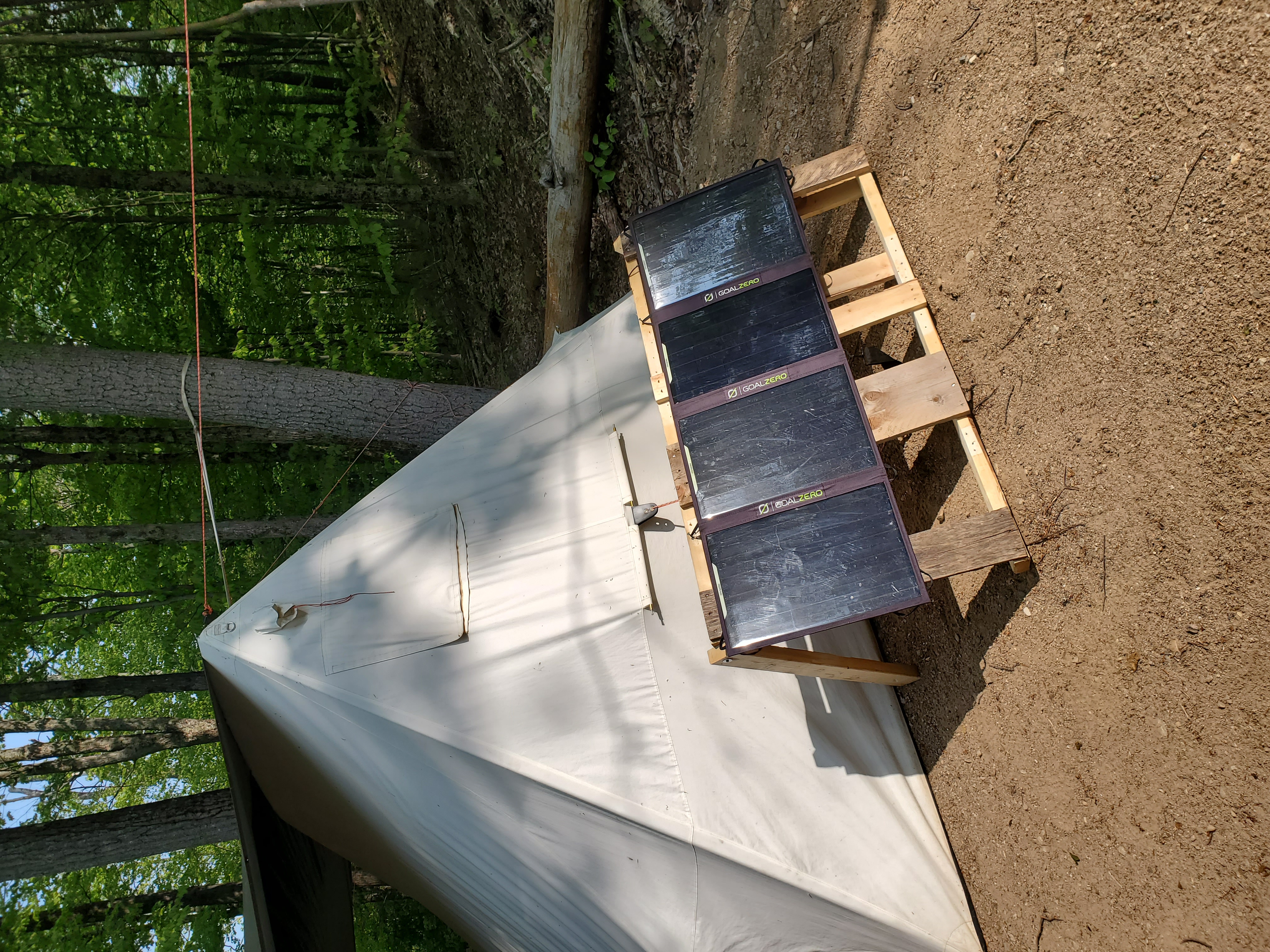 Solar panels outside the canvas tent at the place
